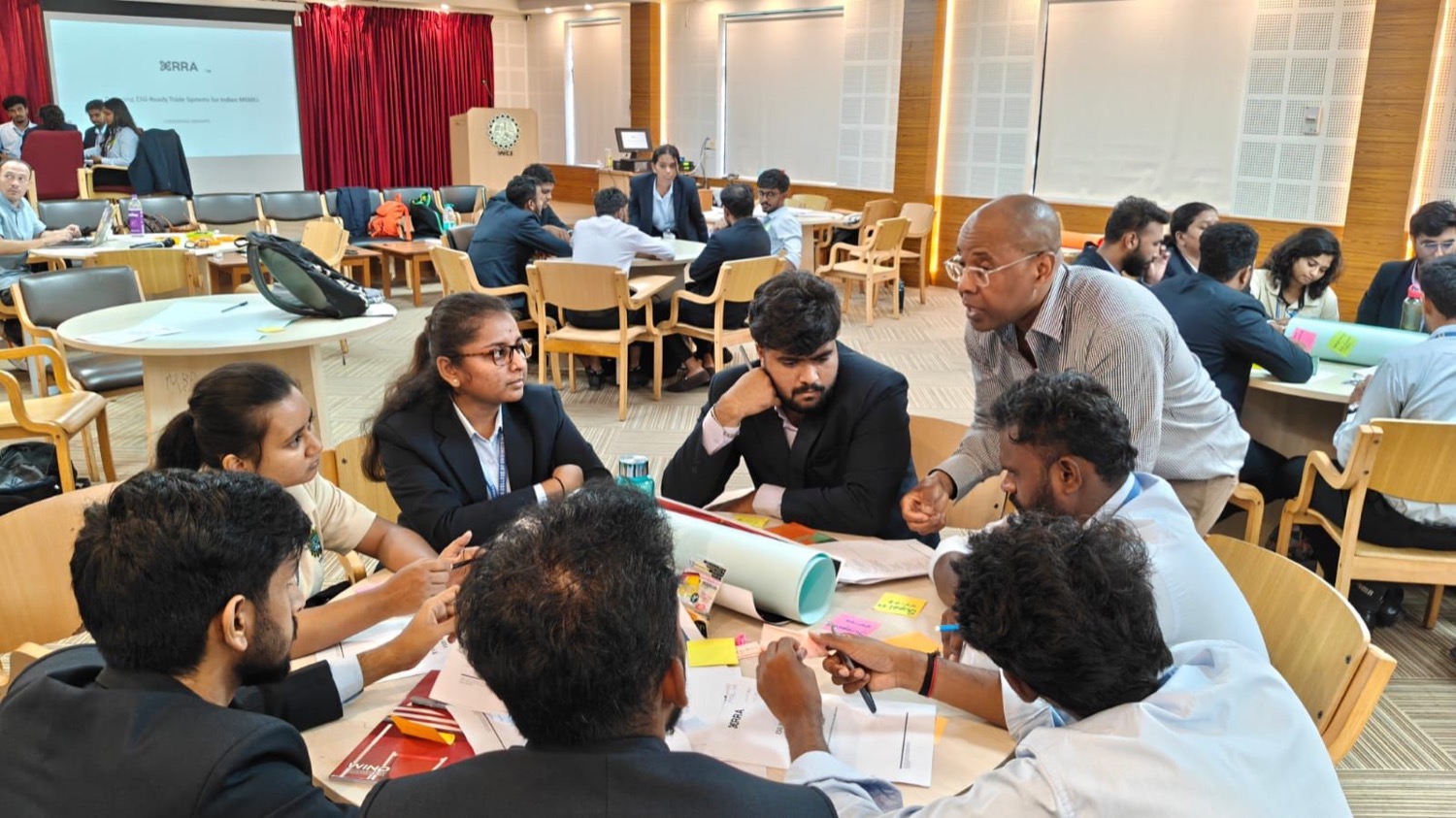 A student team building and refining their startup MVP at a roundtable